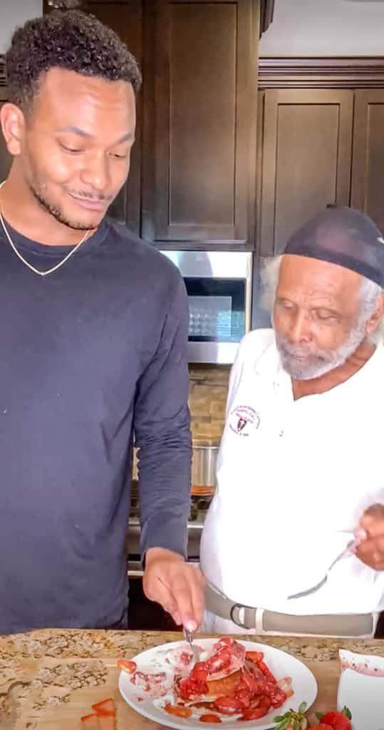 Chef Kolby Kash and his PawPaw in the kitchen making strawberry pancakes.