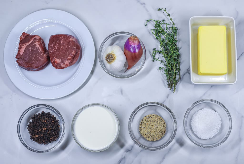 the ingredients needed to make a filet mignon including seasoning, shallots, and thyme