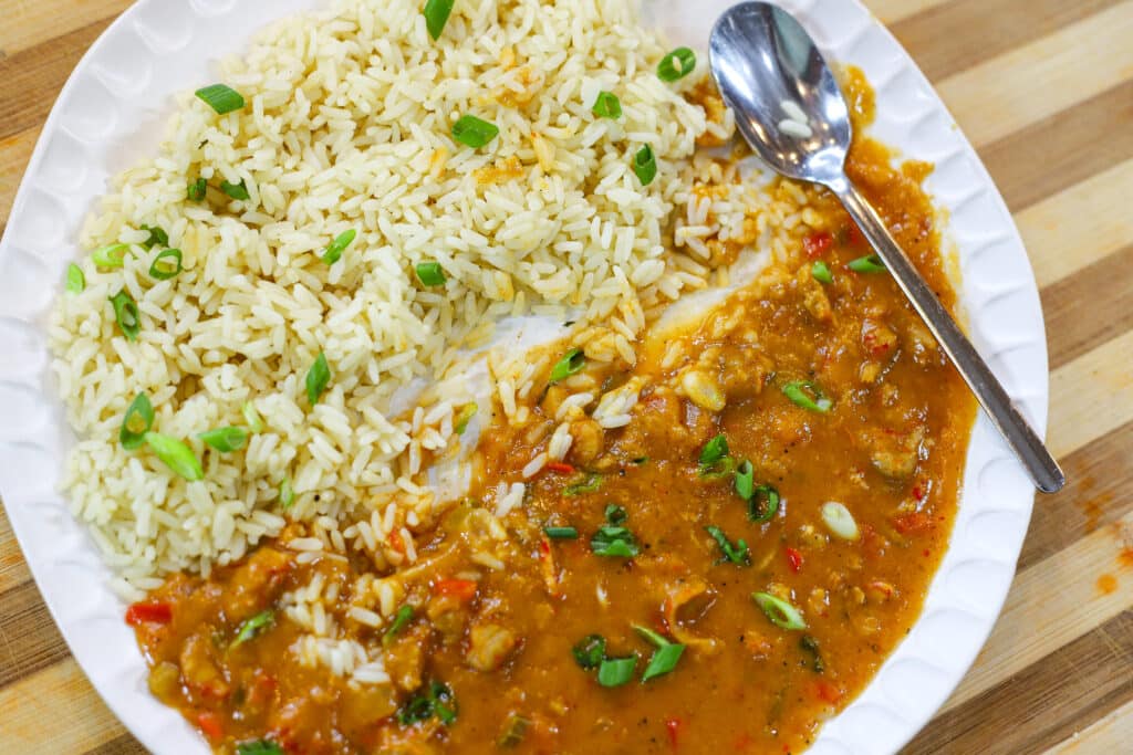 crawfish etouffee in a bowl with rice.