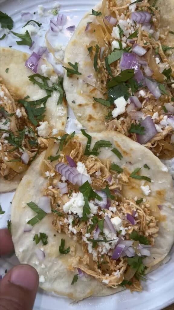 Chicken Tinga assembled into Tacos