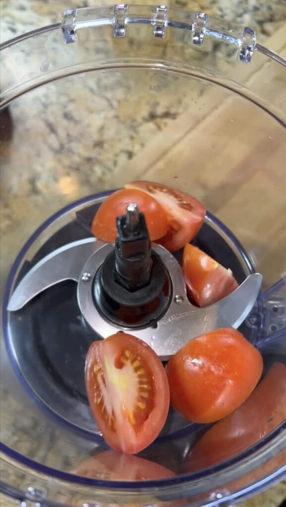 tomato in a food processor to make sauce for chicken Tinga