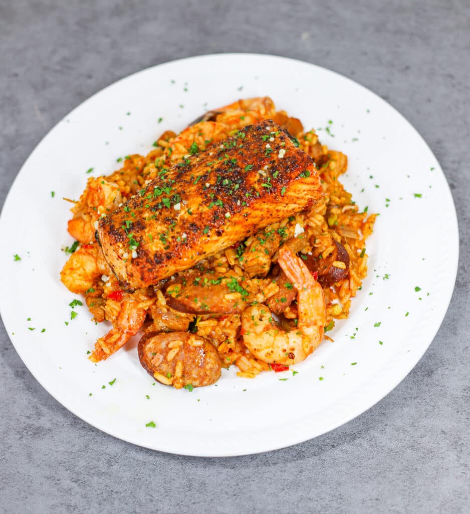 salmon on top of jambalaya