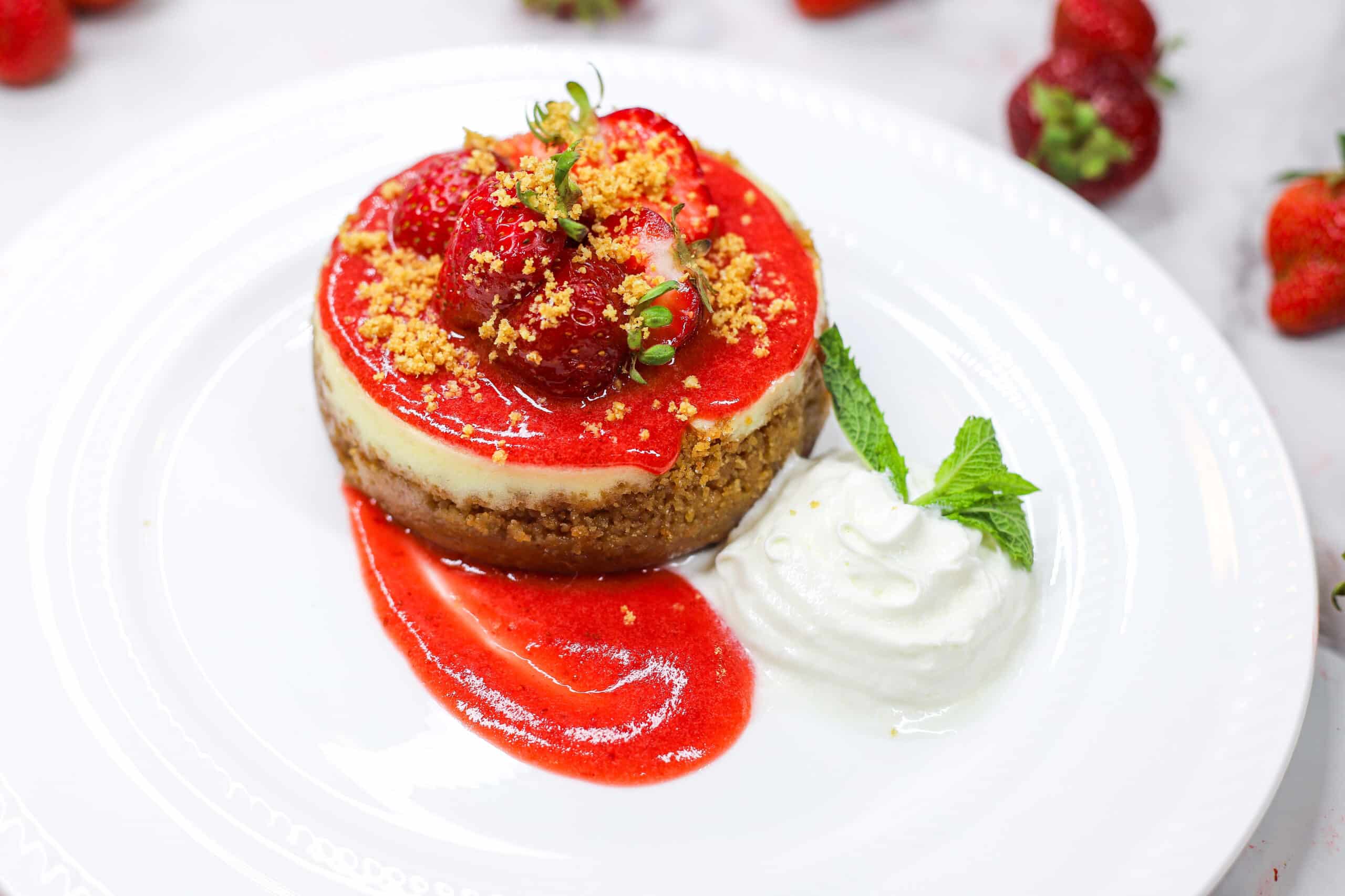 Strawberry Cheesecake with fresh strawberry topping and whipped cream