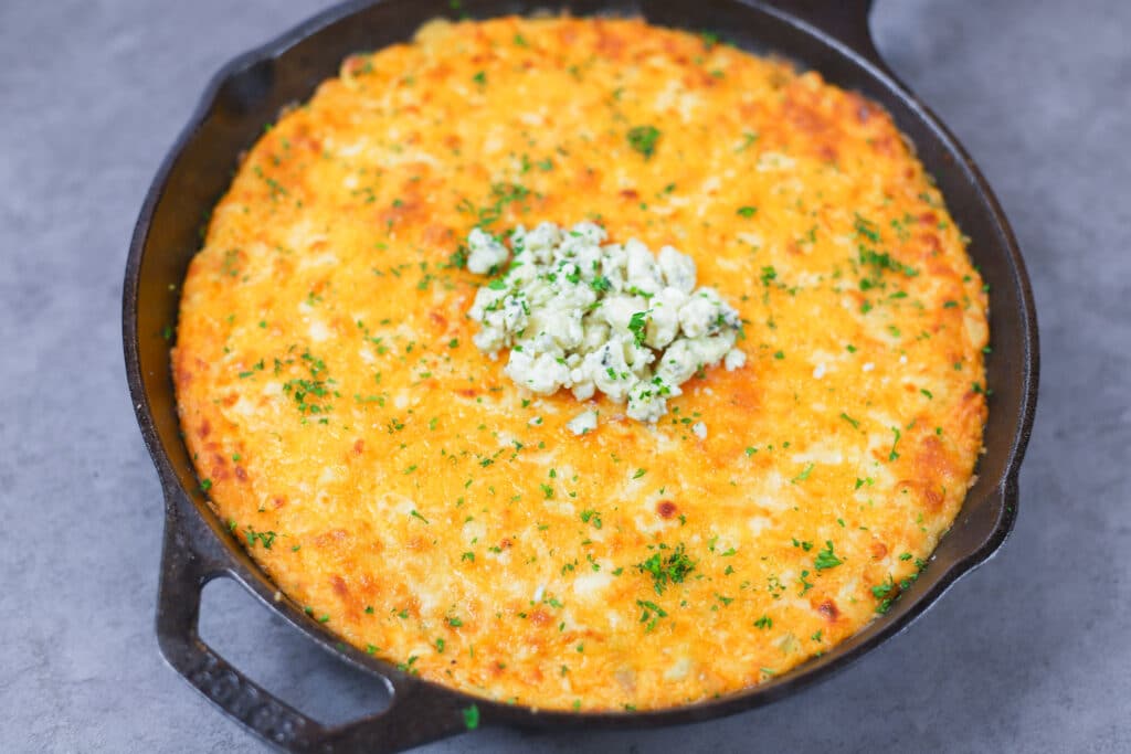 Franks Buffalo Chicken Dip  topped with blue cheese and parsley