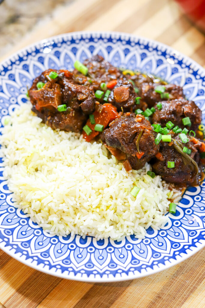 Oxtails plated with rice