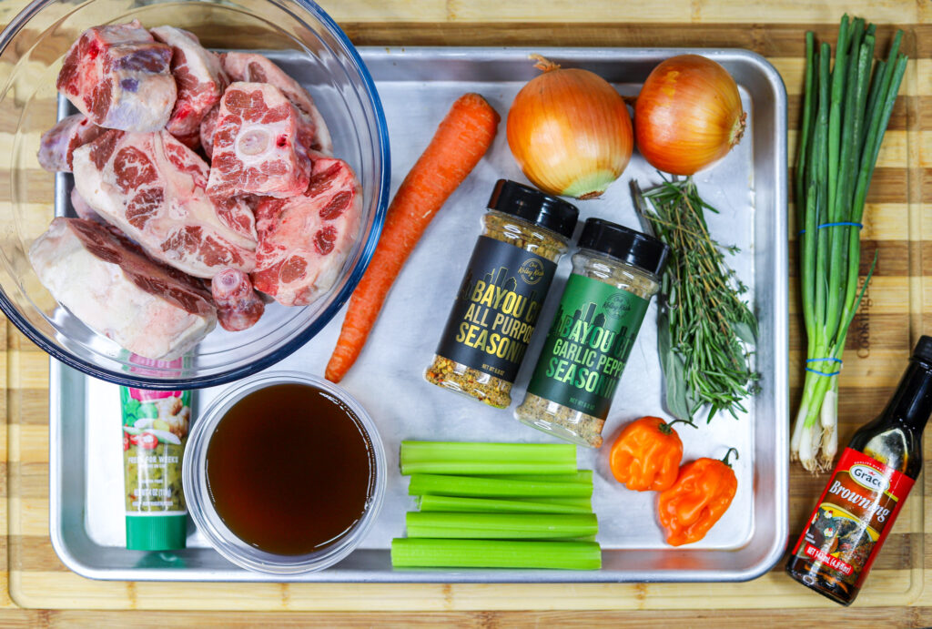 oxtail ingredients: carrot, onion, seasonings, beef stock, celery, habanero, green onion, browning