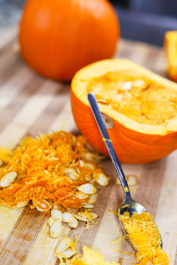 Pumpkin seeds scooped out of pumpkin