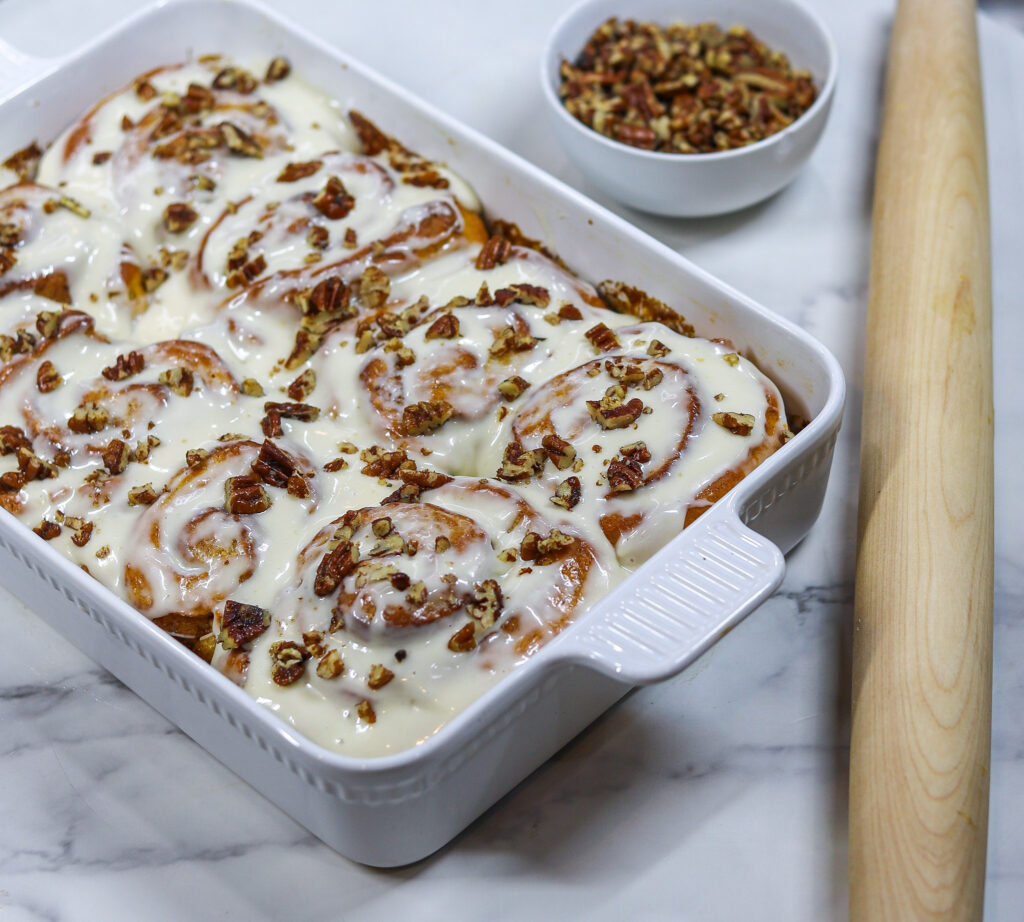 Sweet Potato Cinnamon Rollswith icing and pecans 