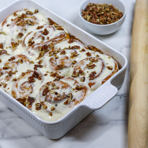 Sweet Potato Cinnamon Rollswith icing and pecans