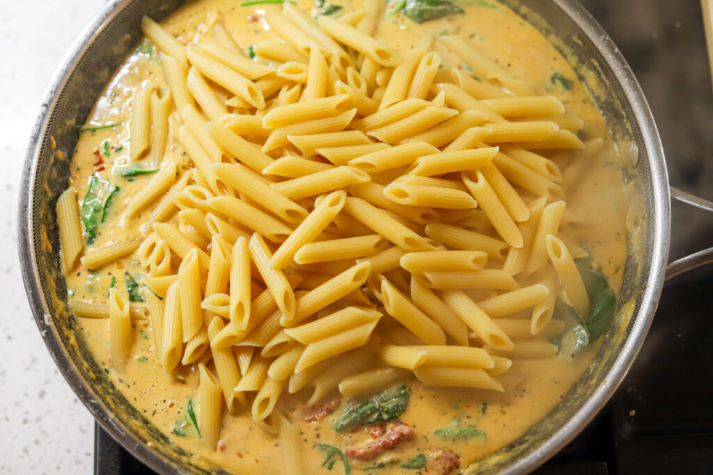 Pasta and chicken tossed in creamy Parmesan sun-dried tomato sauce