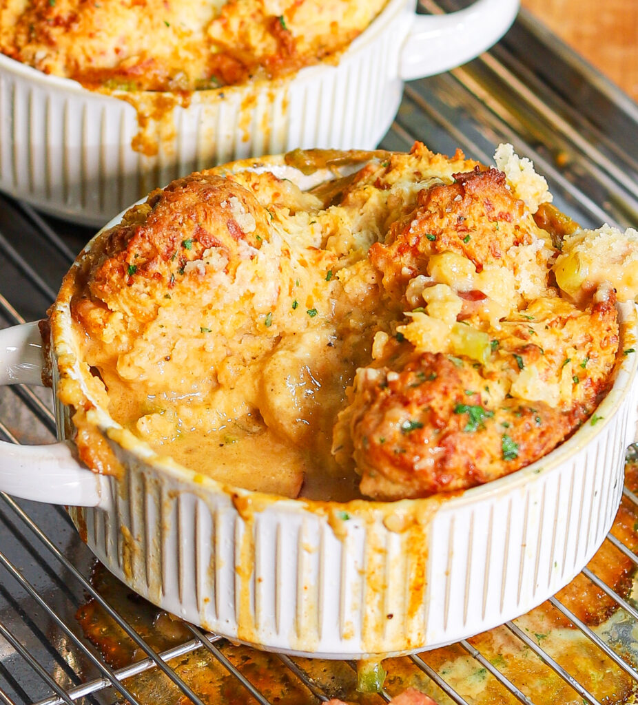 Creamy Creole seafood pot pie topped with cheesy garlic biscuits