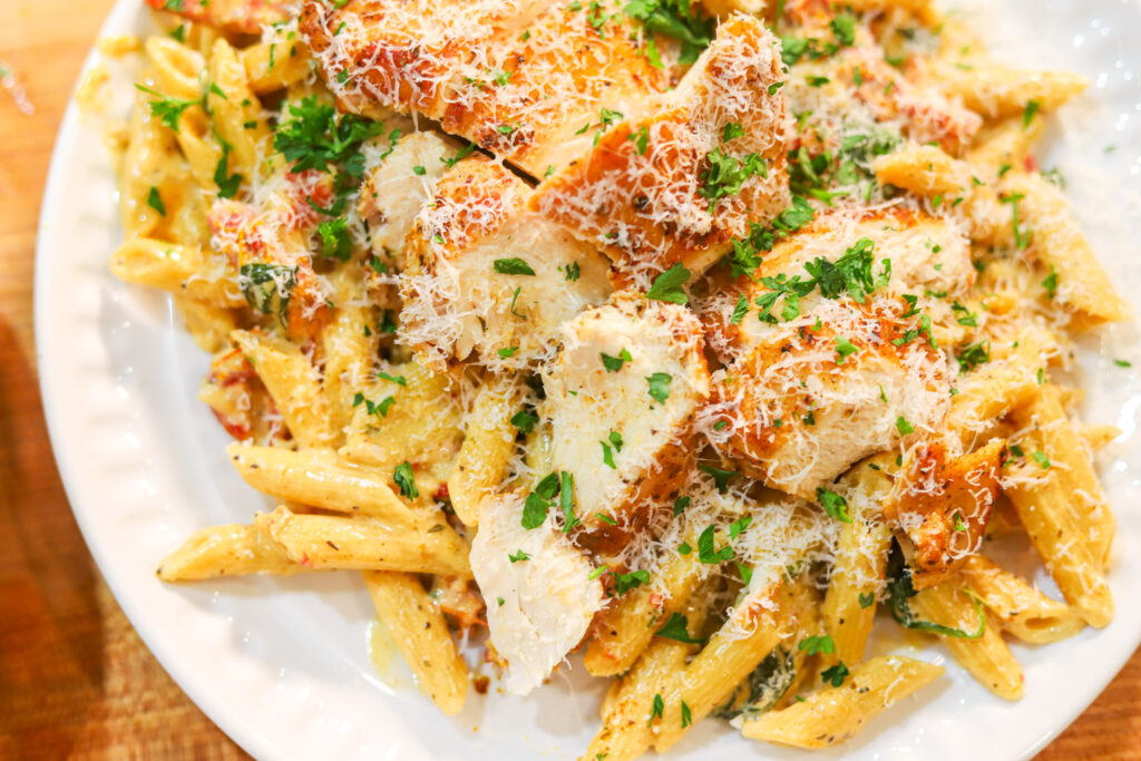 Marry Me Chicken Pasta served with Parmesan and fresh parsley