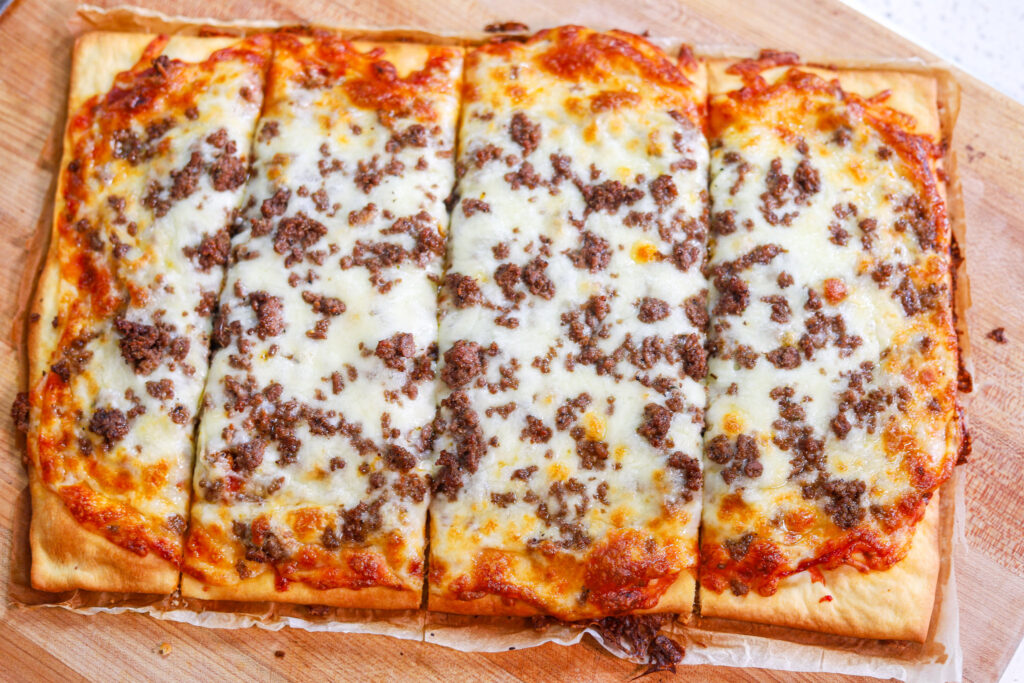 90s style school cafeteria pizza served on a lunch tray