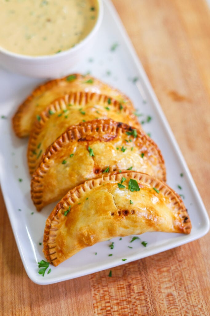 cheeseburger empanada filled with ground beef and melted cheese,