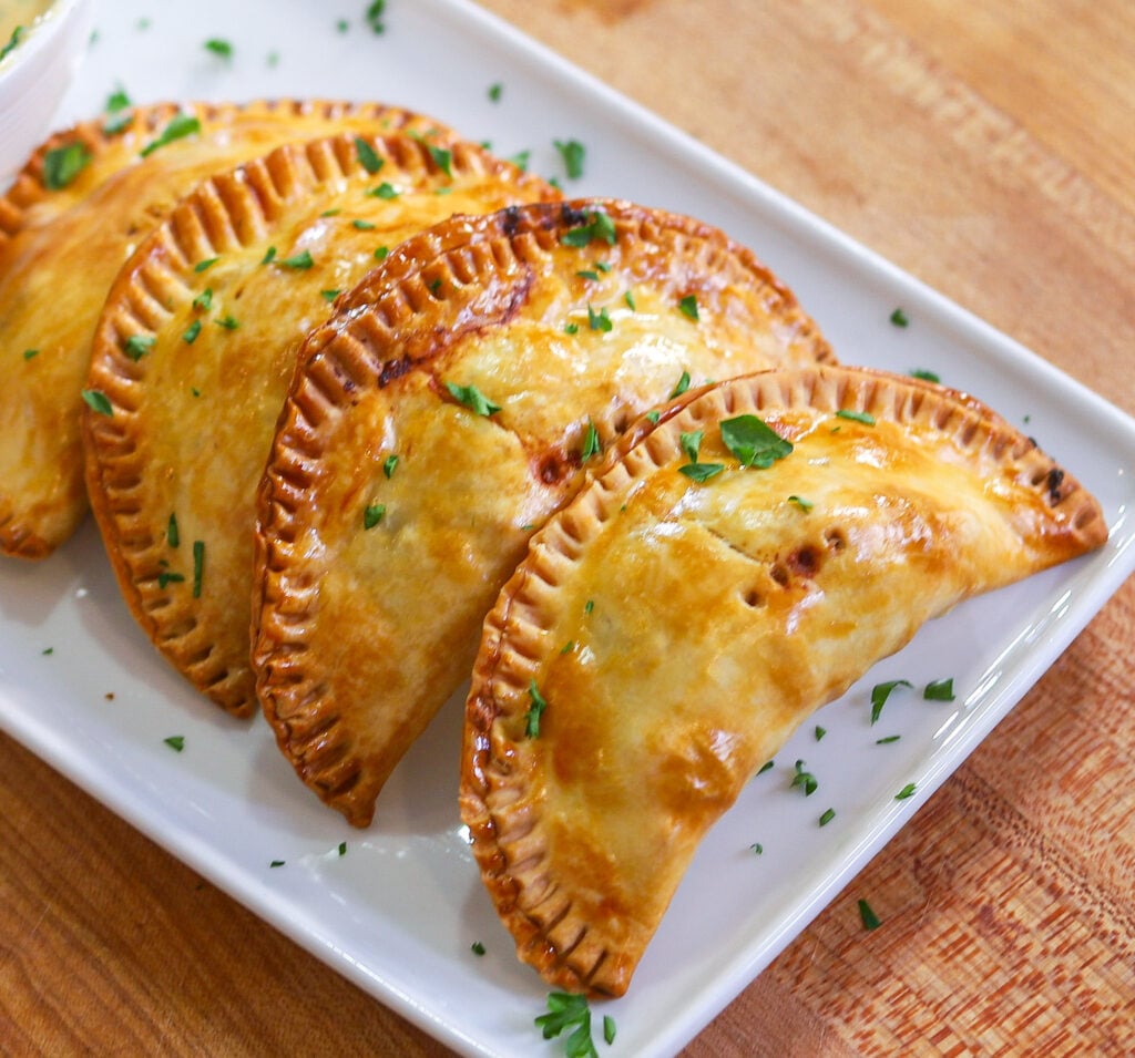 homemade cheeseburger empanadas with burger sauce