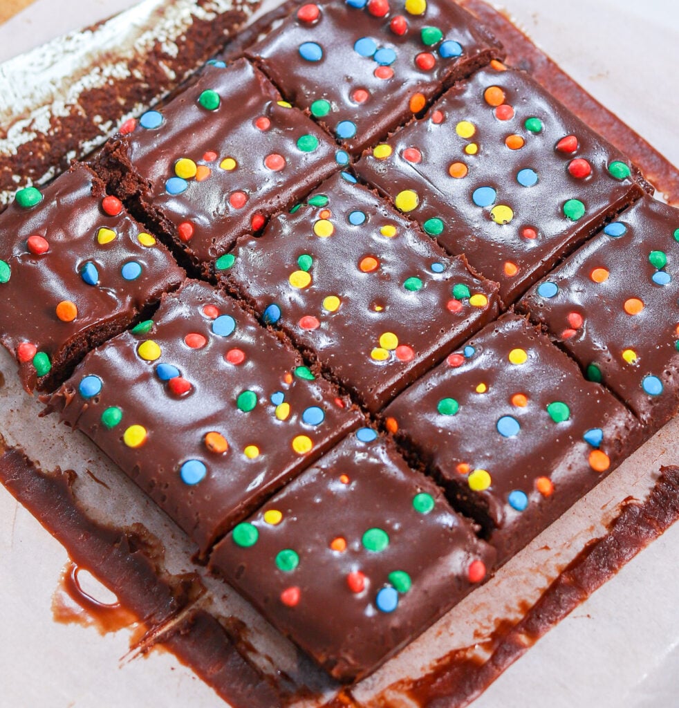 Homemade Cosmic Brownies cut into squares and topped with colorful candy pieces