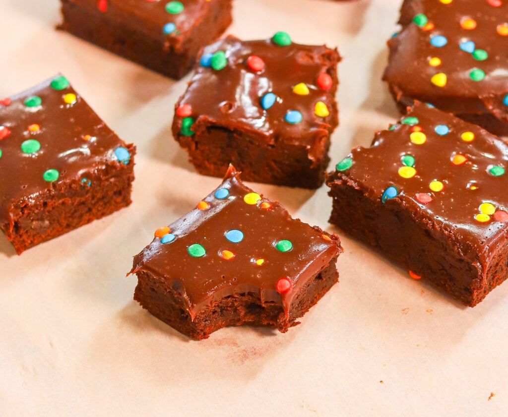 Dense and chewy interior of a homemade Cosmic Brownie with chocolate ganache