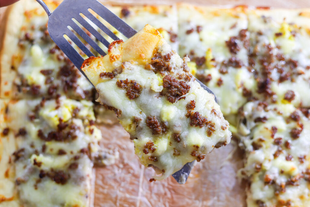 slice of homemade school cafeteria breakfast pizza