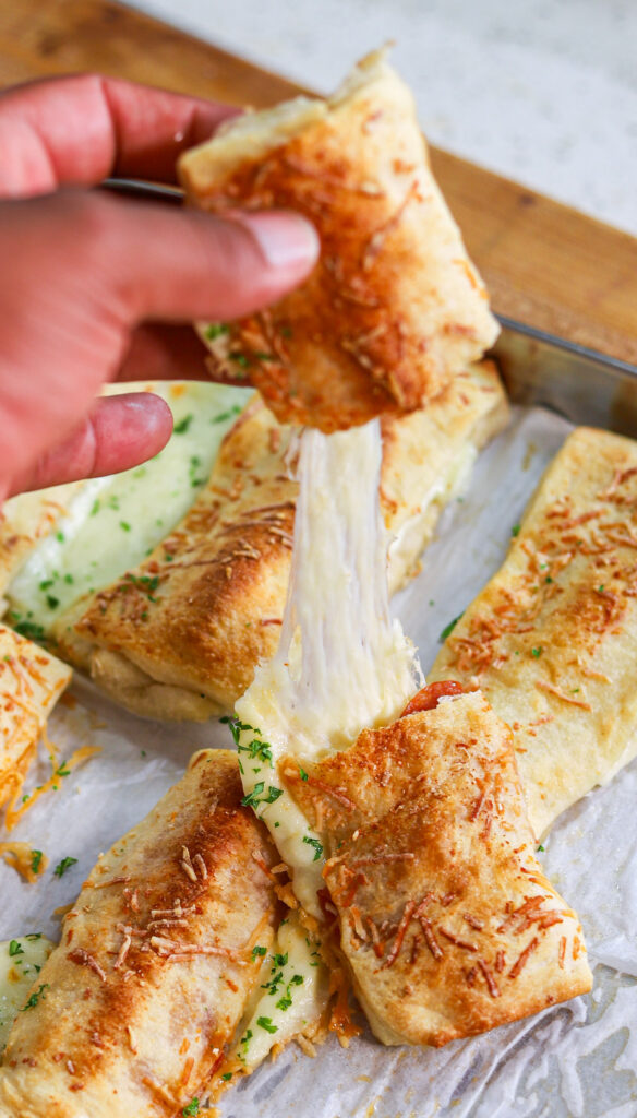 school cafeteria cheese breadsticks stuffed with mozzarella and topped with Parmesan cheese.