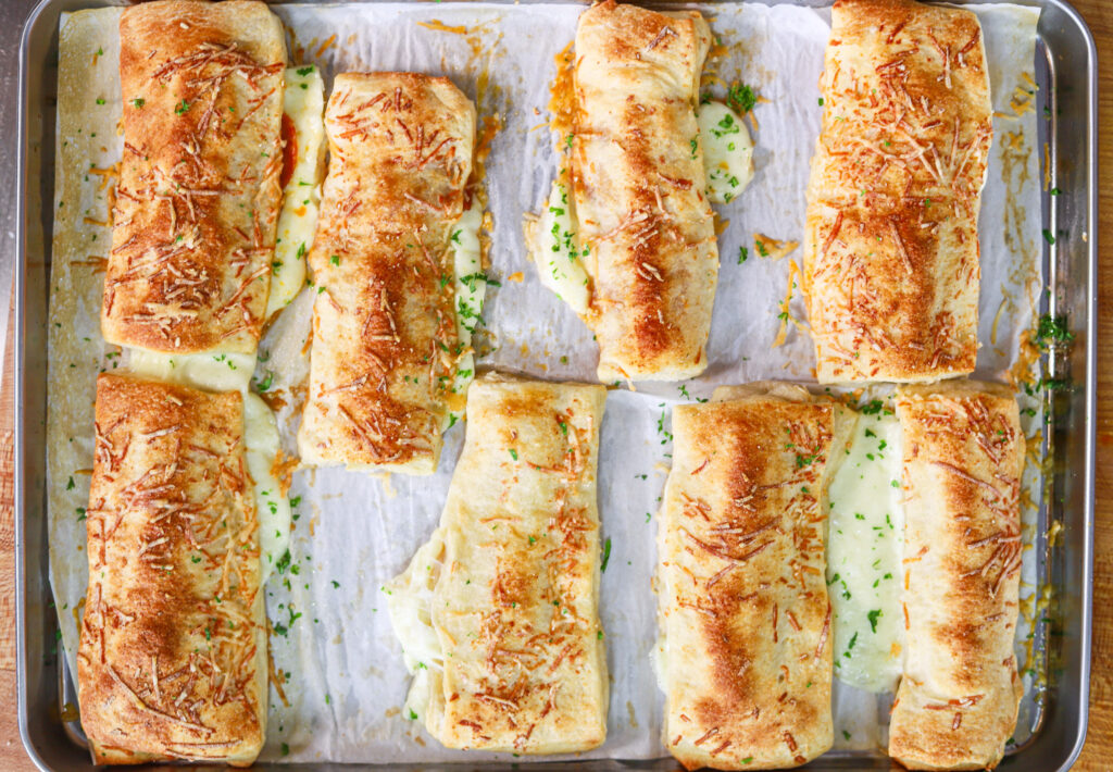 homemade school lunch cheese breadsticks with pizza sauce