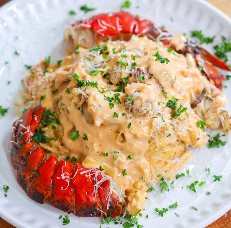Restaurant-style lobster fettuccine coated in a creamy garlic butter sauce with freshly grated Parmesan.